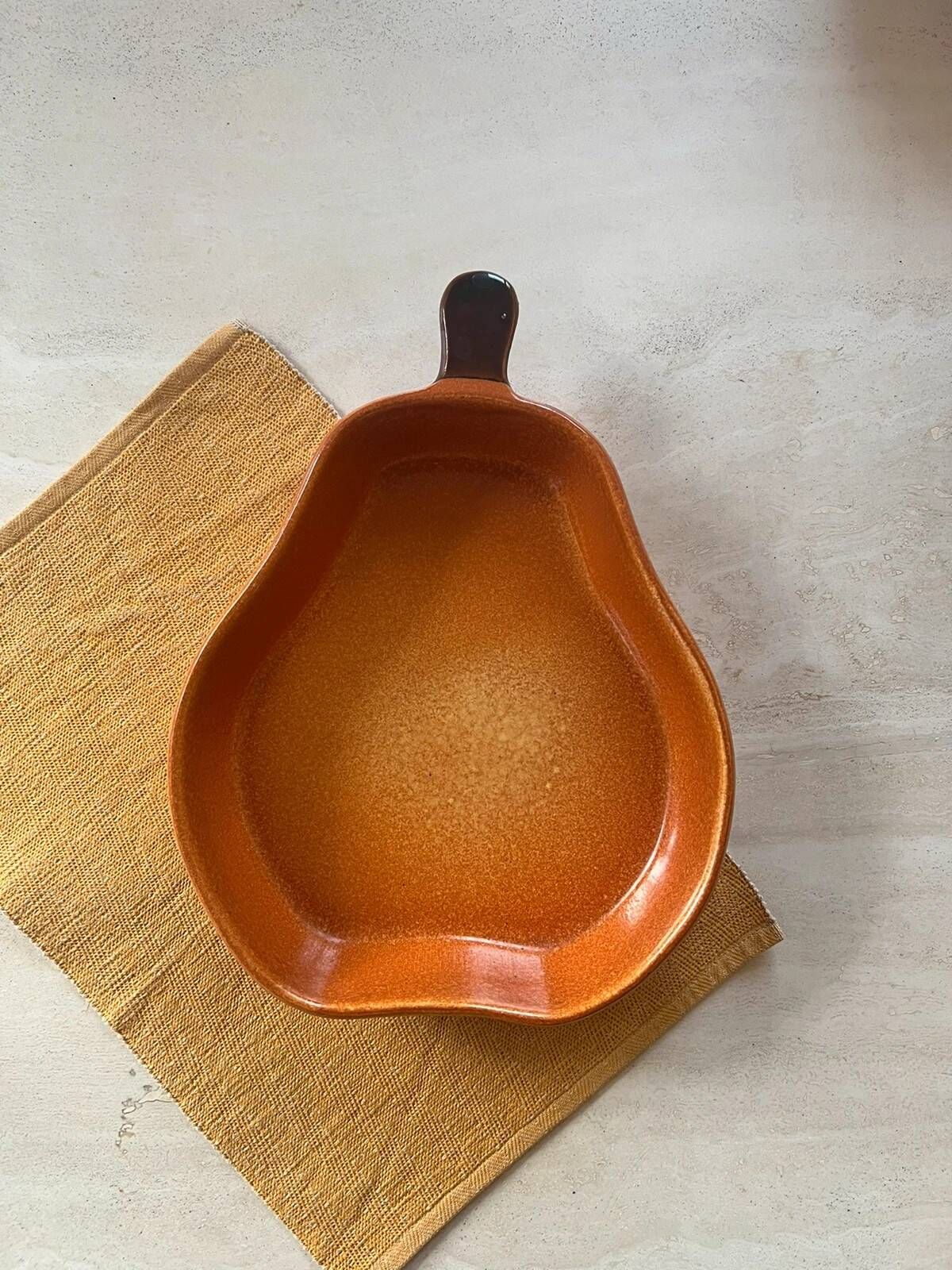 Ceramic dish in the shape of a pear.