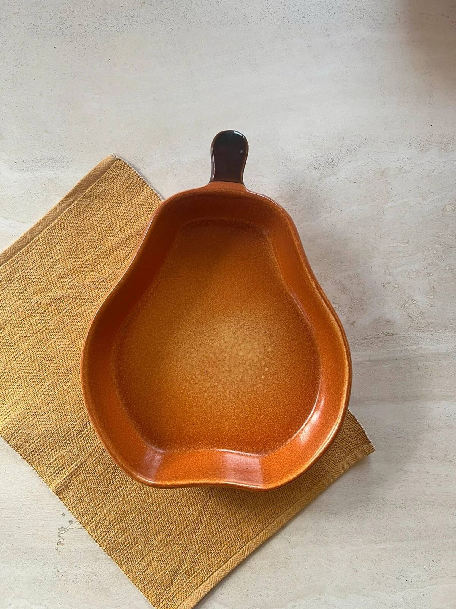 Ceramic dish in the shape of a pear.
