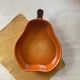 Ceramic dish in the shape of a pear.