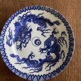 Asian porcelain plates decorated with blue dragons