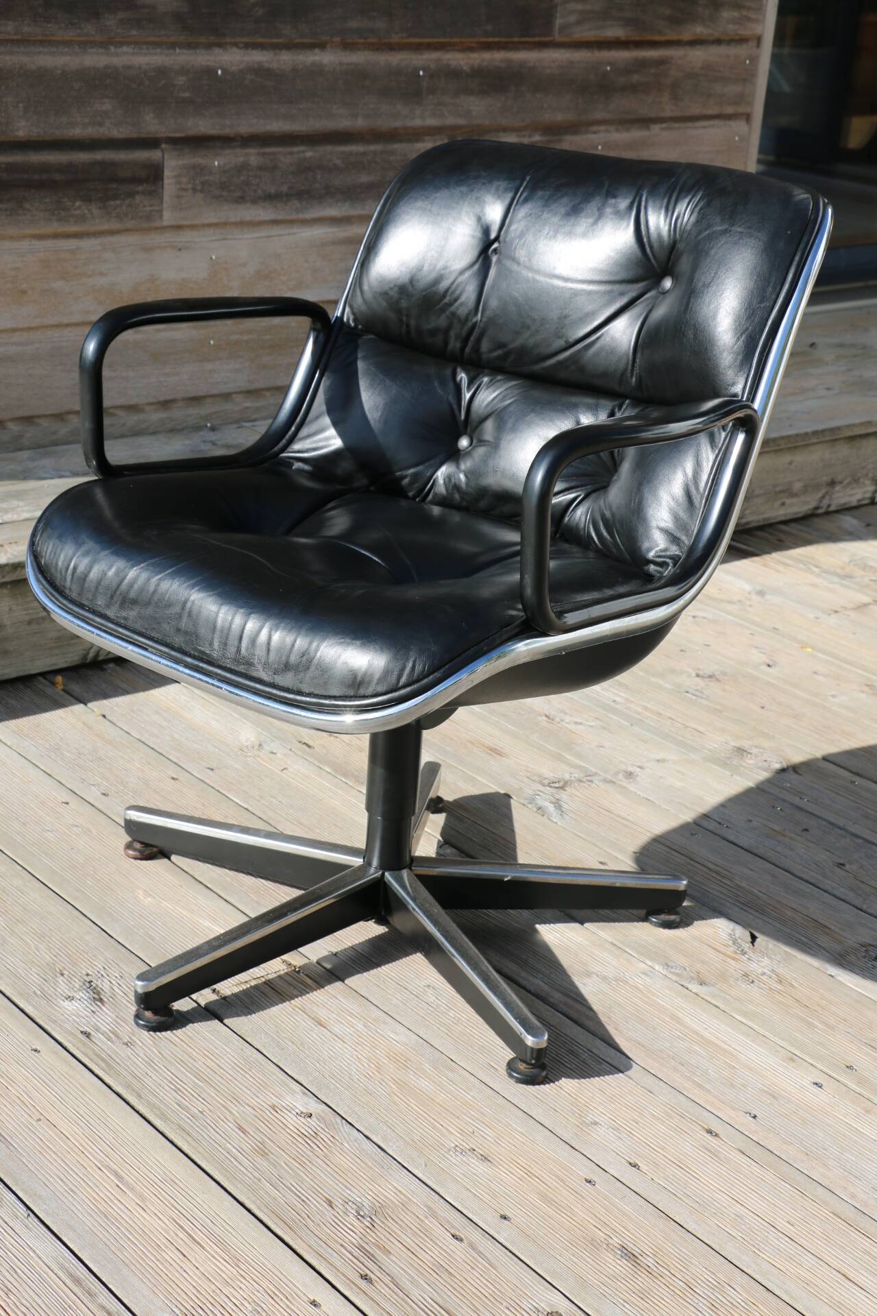 Pollock black leather reclining armchair with fixed ends