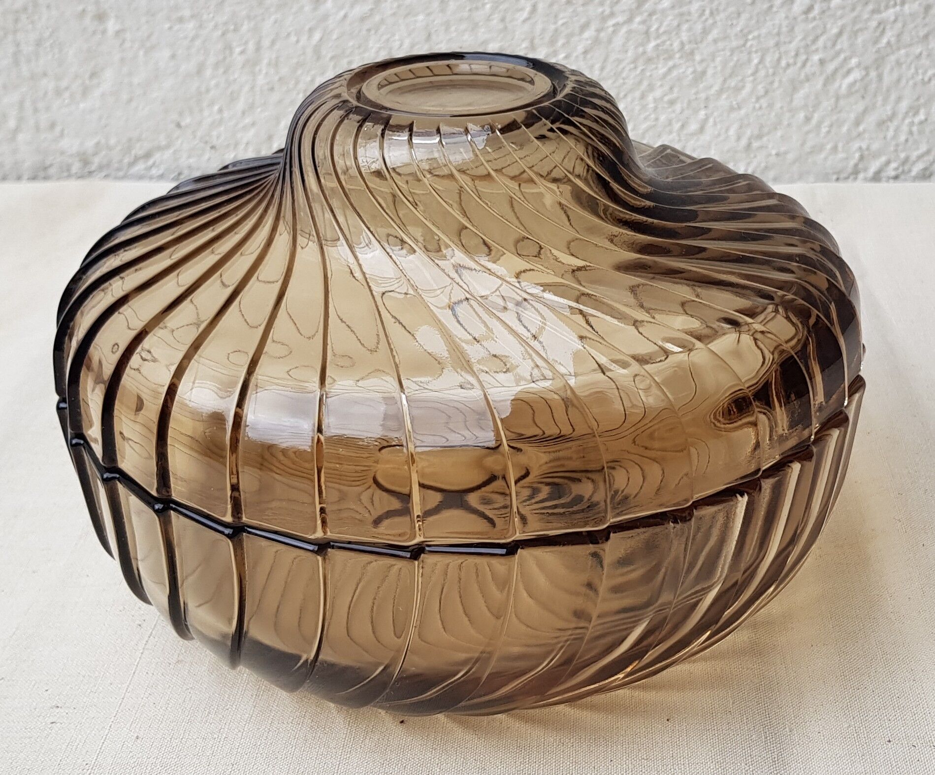 Empty amber glass pocket with lid