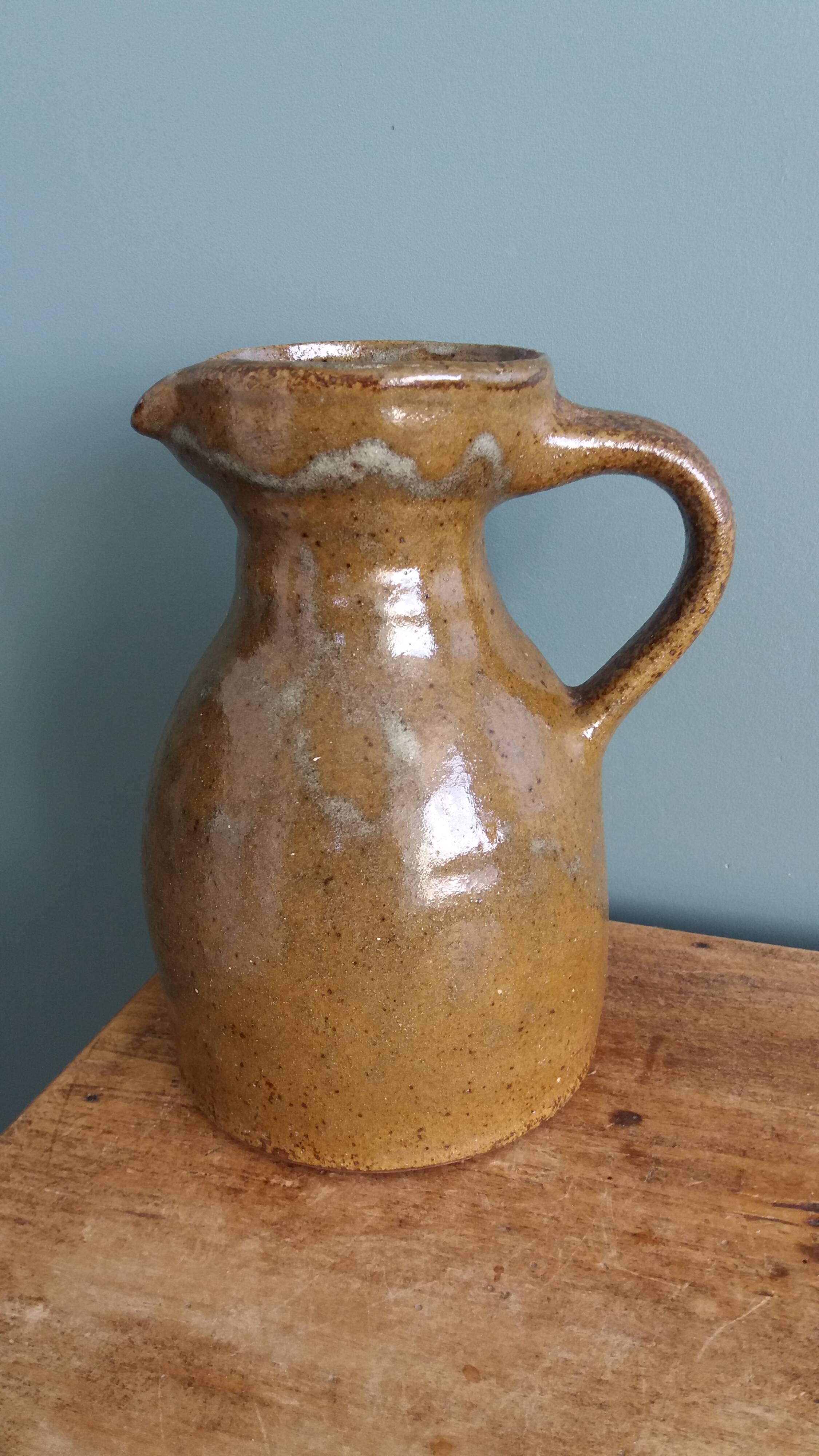 Rustic stoneware jug, chic countryside.