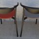 4 Gondola-style chairs with a sturdy metal frame and faux leather for