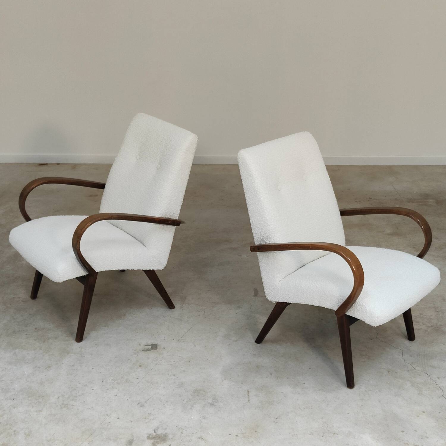 Pair of Jaroslav Smidek armchairs for Ton Bystrice, restored with white boucle, 1960.
