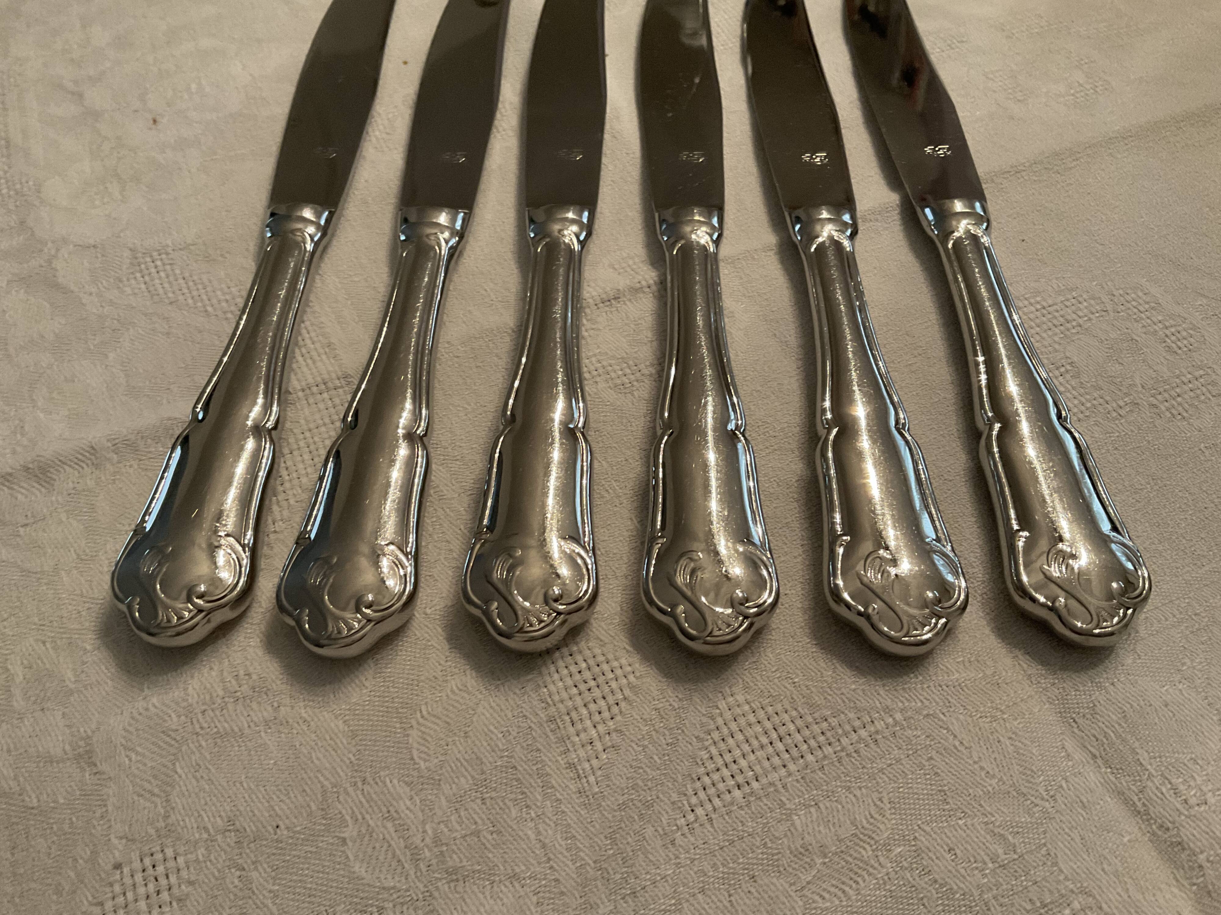 12 stainless steel knives. vintage