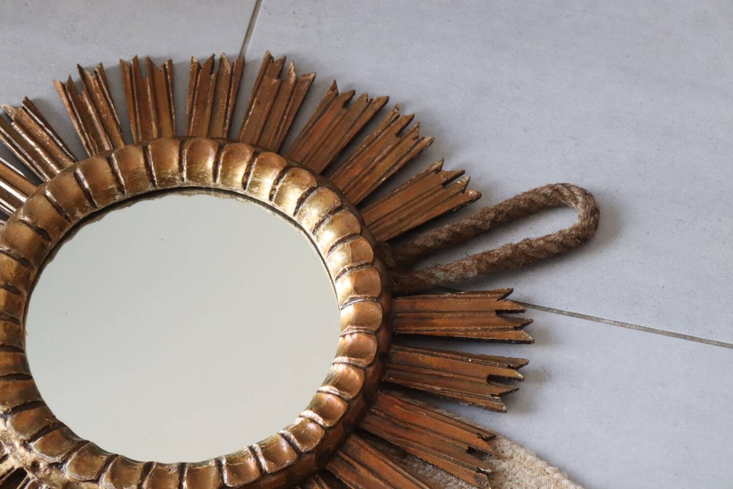 Old large sun mirror in gilded wood