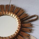 Old large sun mirror in gilded wood