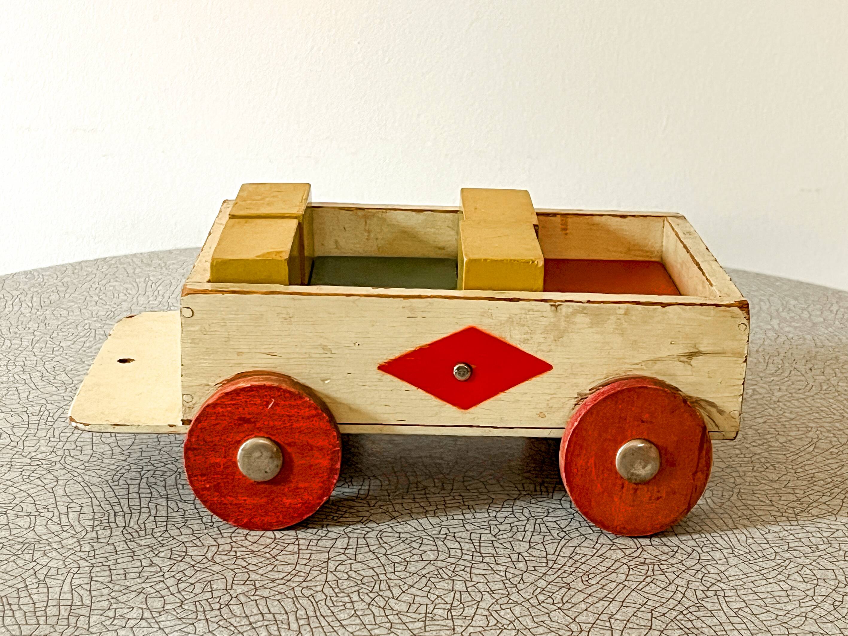 Wooden pull-along toy with coloured blocks, vintage toy.