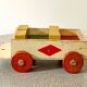 Wooden pull-along toy with coloured blocks, vintage toy.