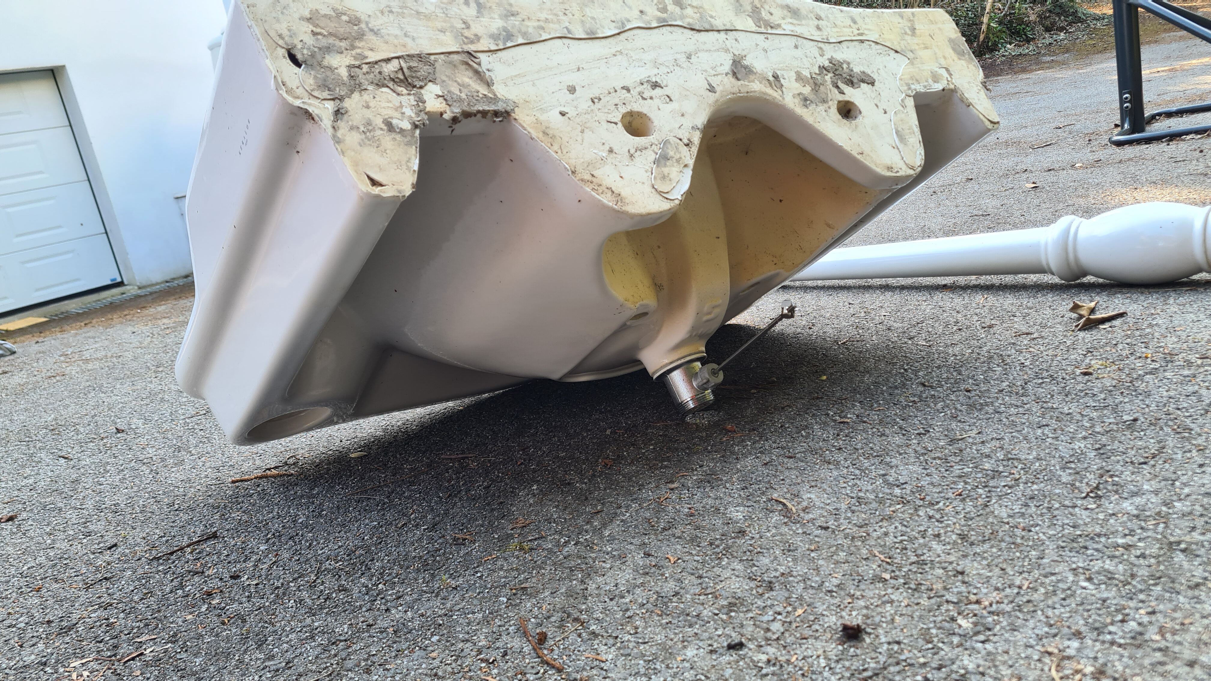 White ceramic wall washbasin with 2 ceramic legs