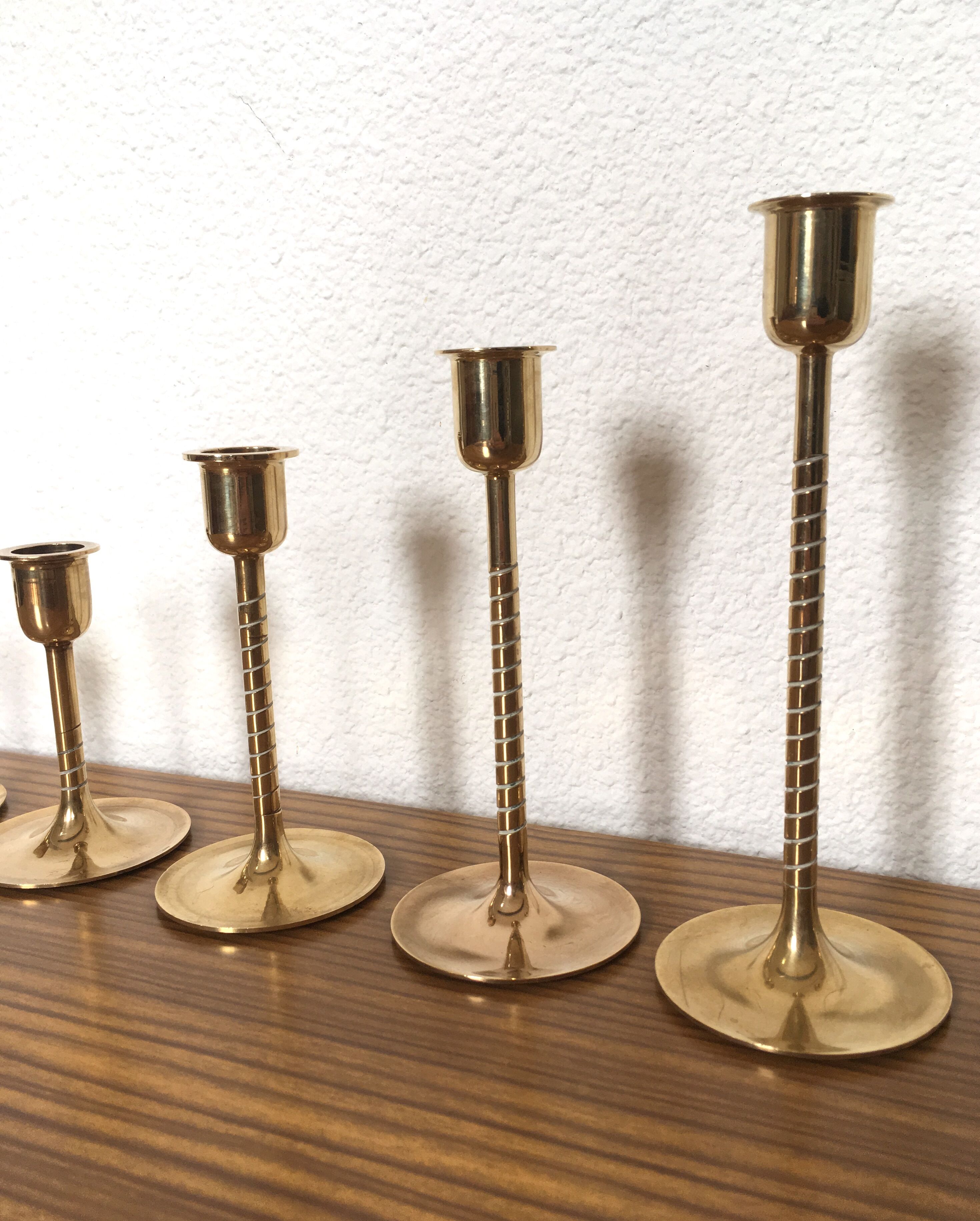Series of 7 Scandinavian brass candlesticks