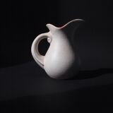 White and orange pitcher with organic curves