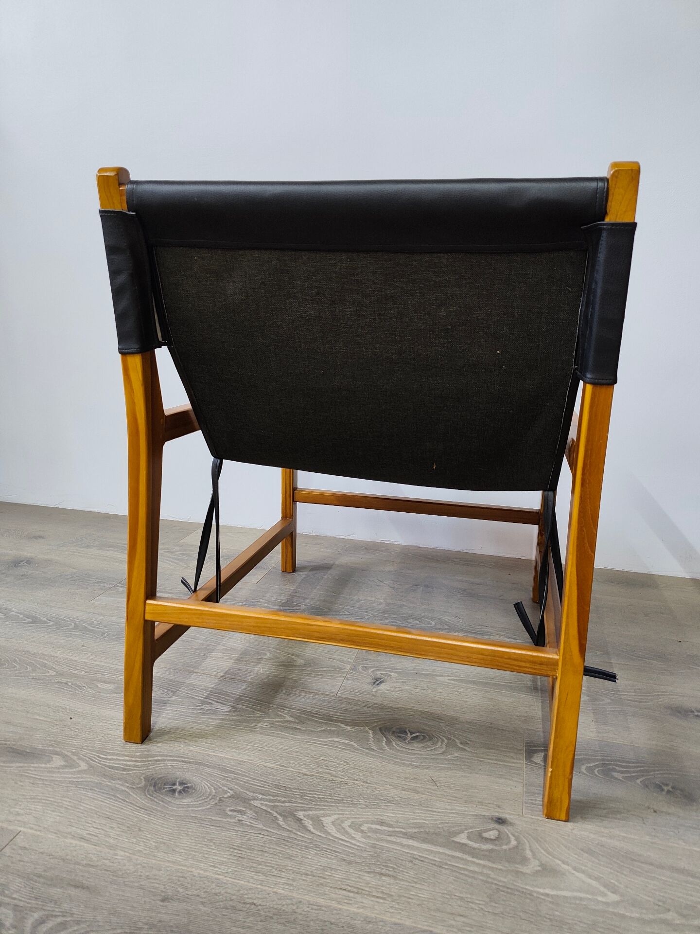 Leather and teak armchair