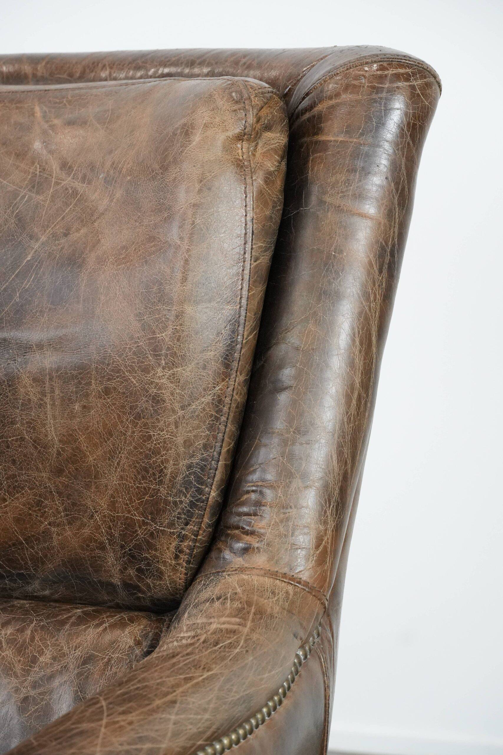 Very comfortable vintage cow leather armchair with character