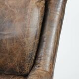 Very comfortable vintage cow leather armchair with character