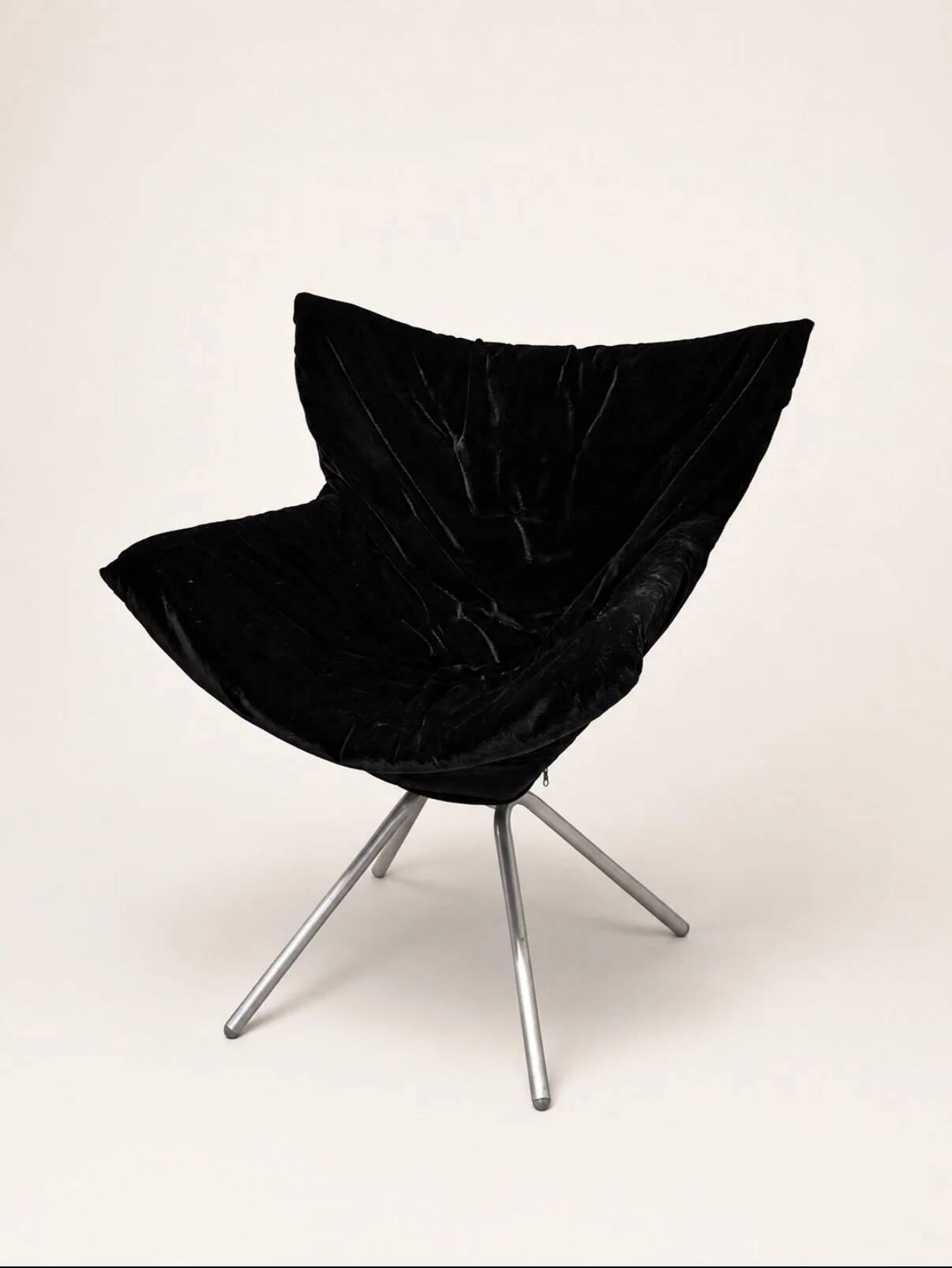 Vintage black velvet swivel lounge chair, sculptural butterfly shape.