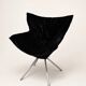 Vintage black velvet swivel lounge chair, sculptural butterfly shape.