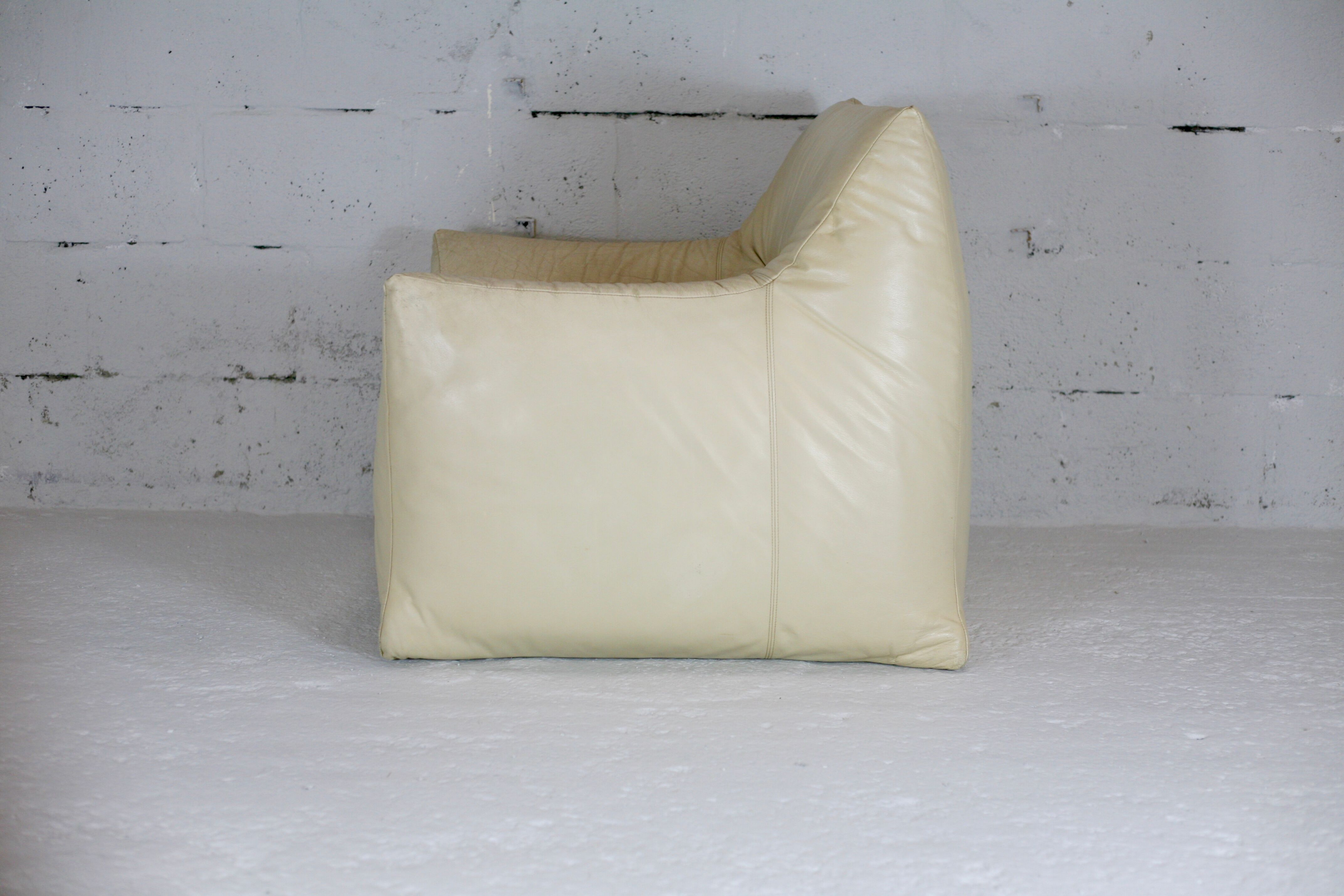 Leather armchair and cream-coloured foam, France , circa 1970