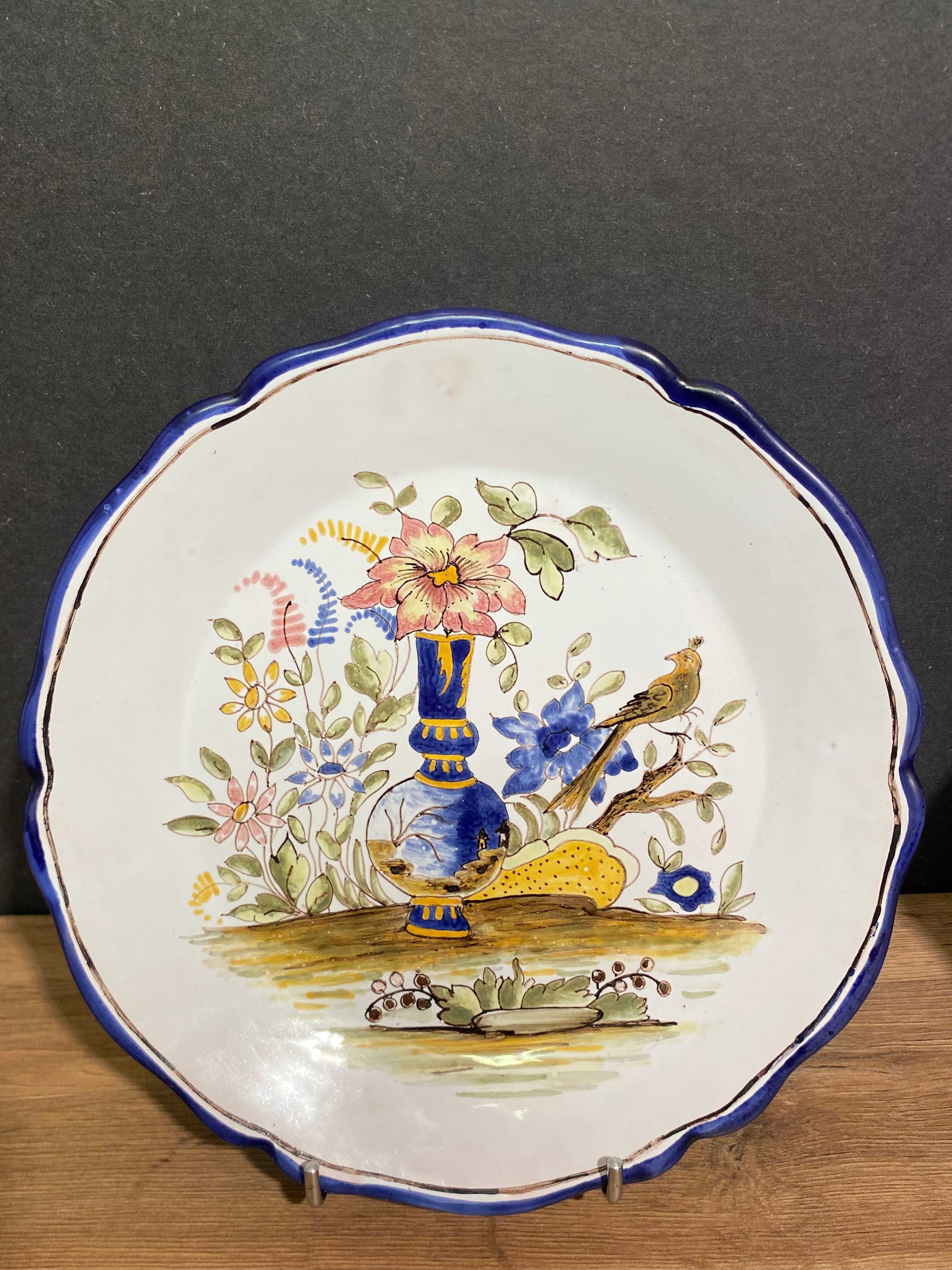 Pair of Nevers earthenware plates signed Georges