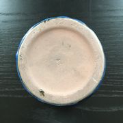 Navy blue stoneware pot.