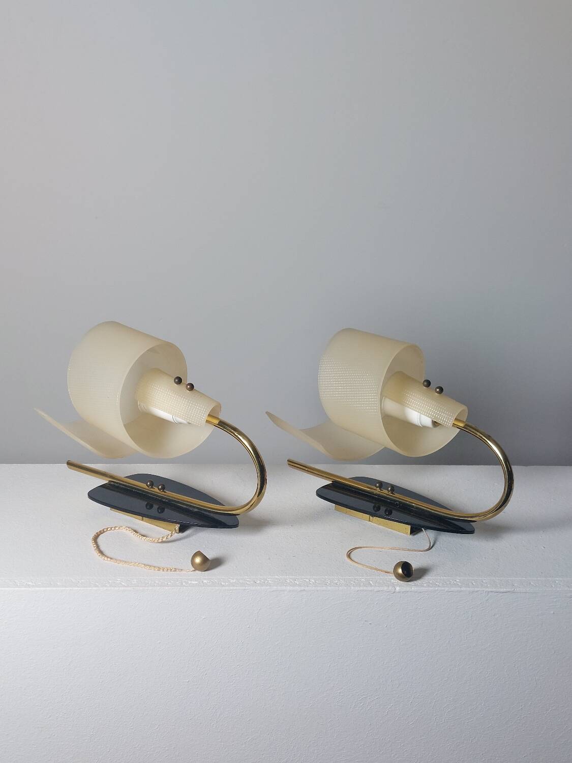 Pair of vintage wall lamps from the 1950s in brass.