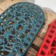 Duo of oval red and green cast iron trivets 60s 70s