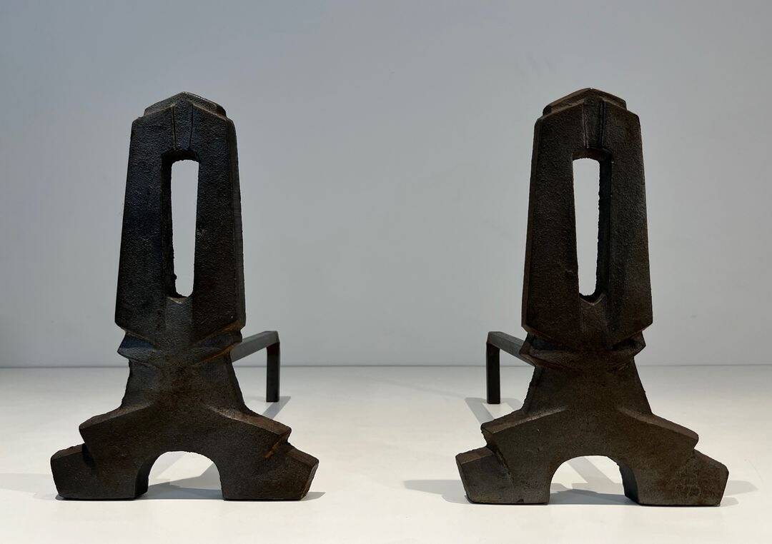 Pair of Modernist Andirons in Cast Iron with Openwork Uprights and Tripod Bases