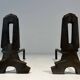 Pair of Modernist Andirons in Cast Iron with Openwork Uprights and Tripod Bases