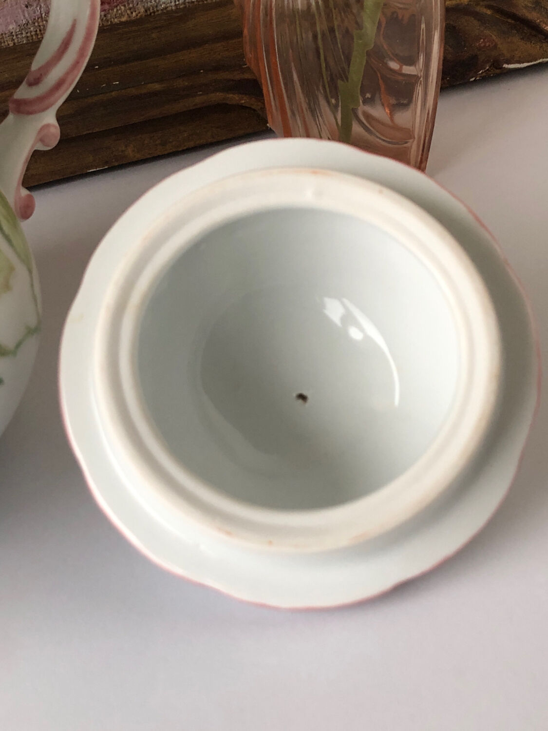 Old white and pink teapot