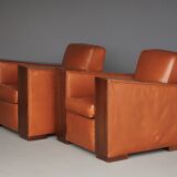 Paire de fauteuils Art Déco en cuir. Années 40.