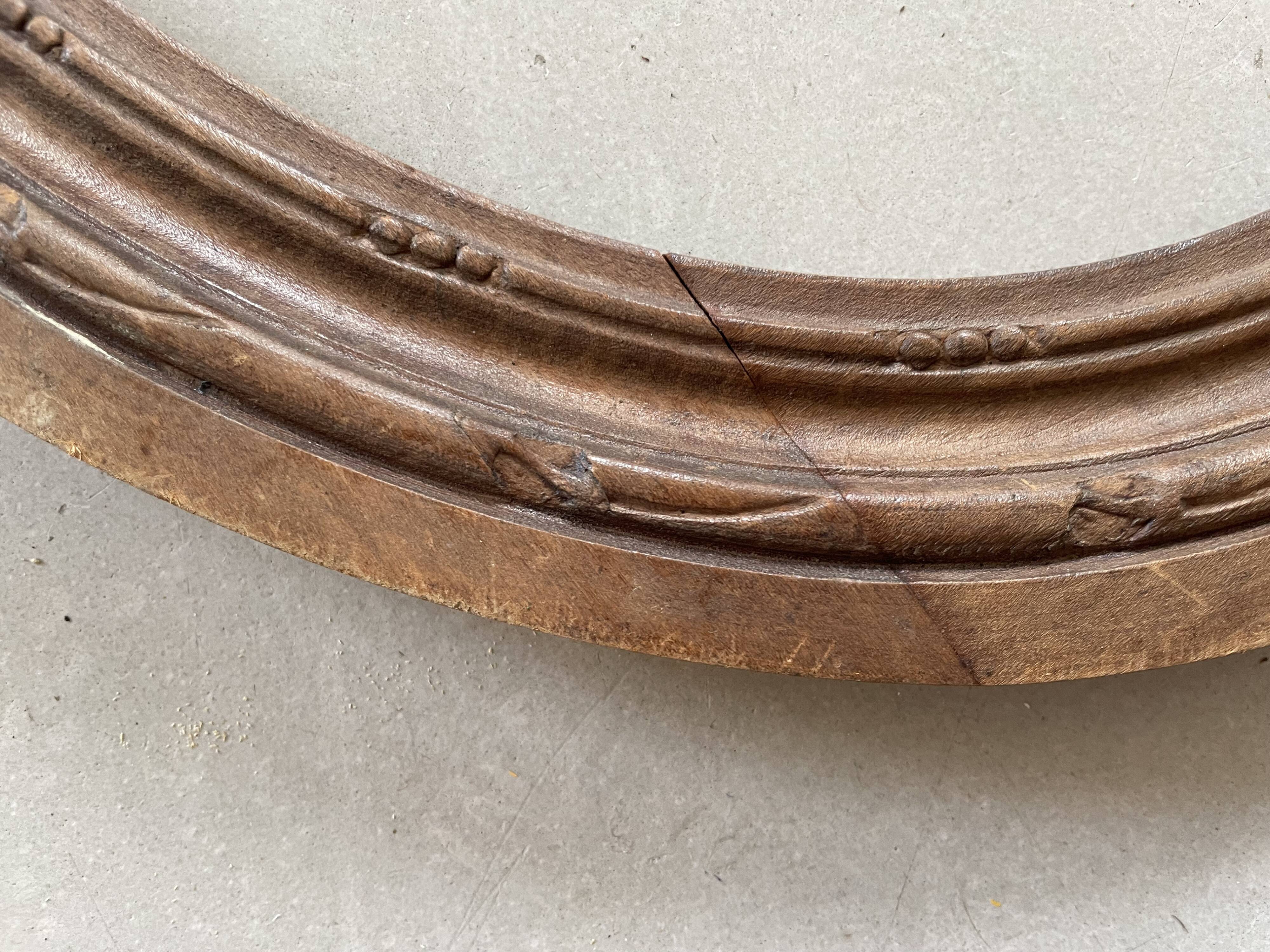 Oval old wooden frame