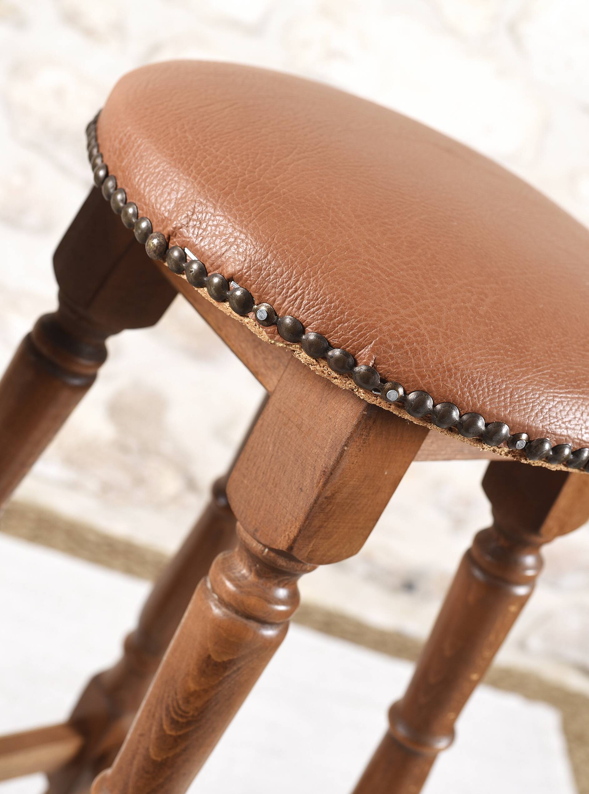 Antique bar stools, brown leather and wood