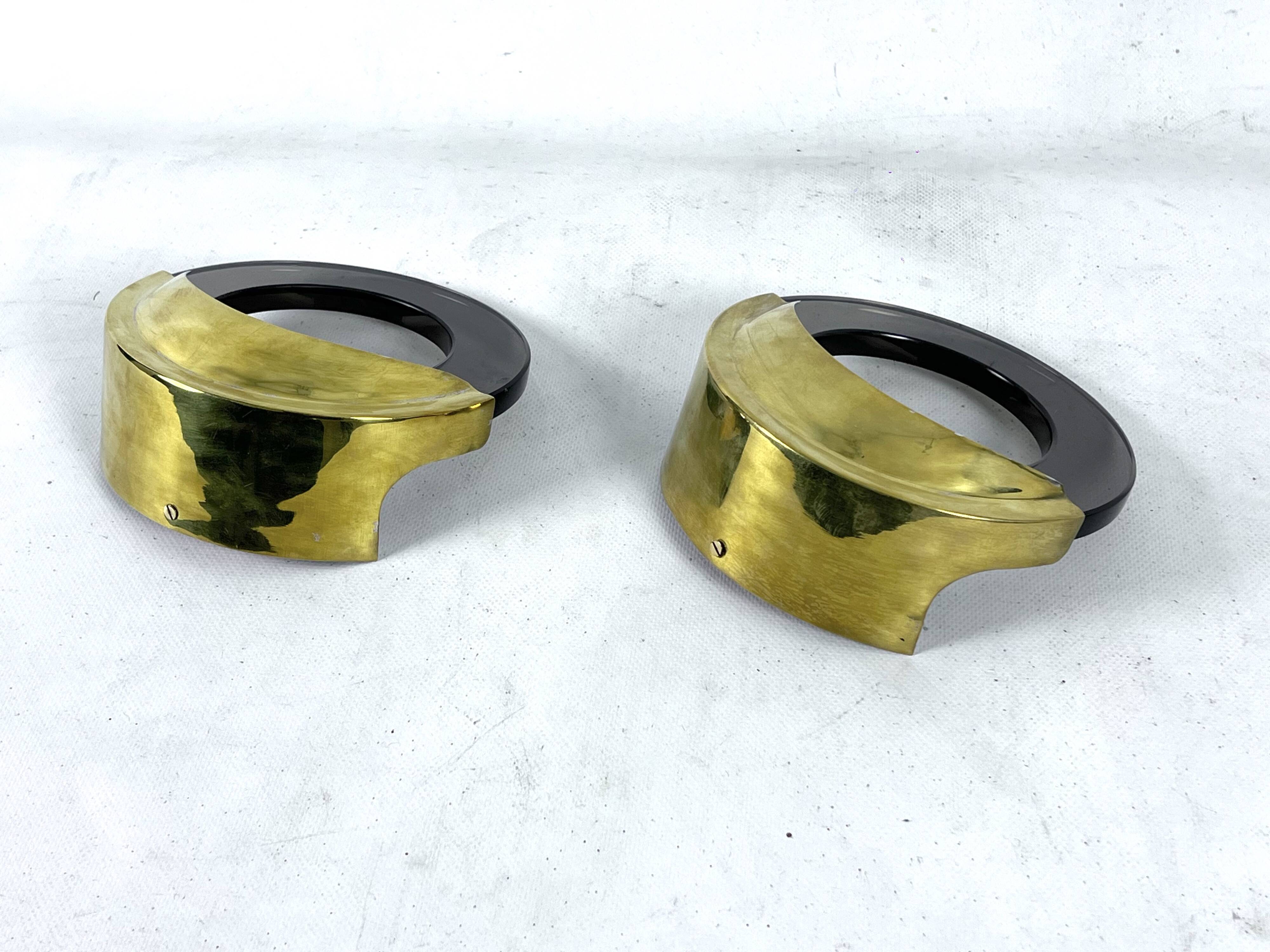 Mid-Century Modern pair of brass and thick smoked glass sconces. Italy 1970s