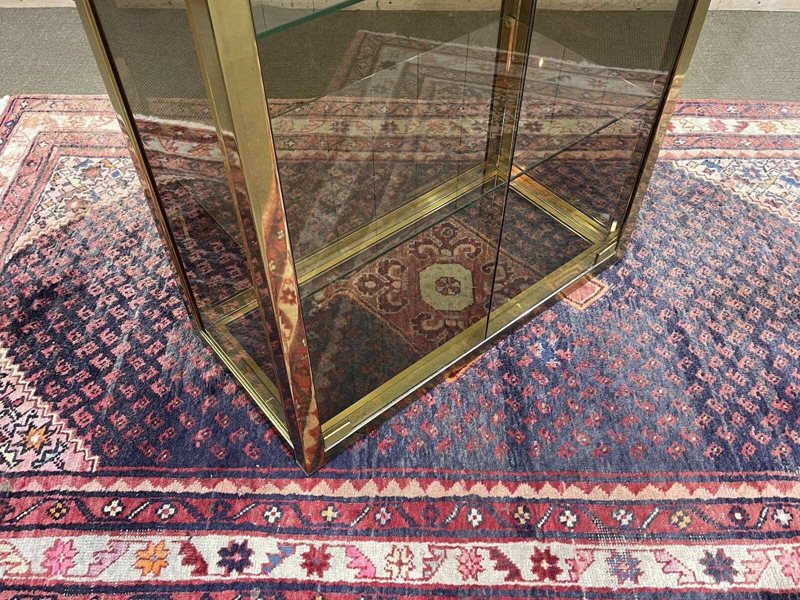 Exhibition showcase in gold-plated chrome and smoked glass - work from the 1980s.