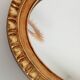 Miroir ovale italien vintage en bois doré