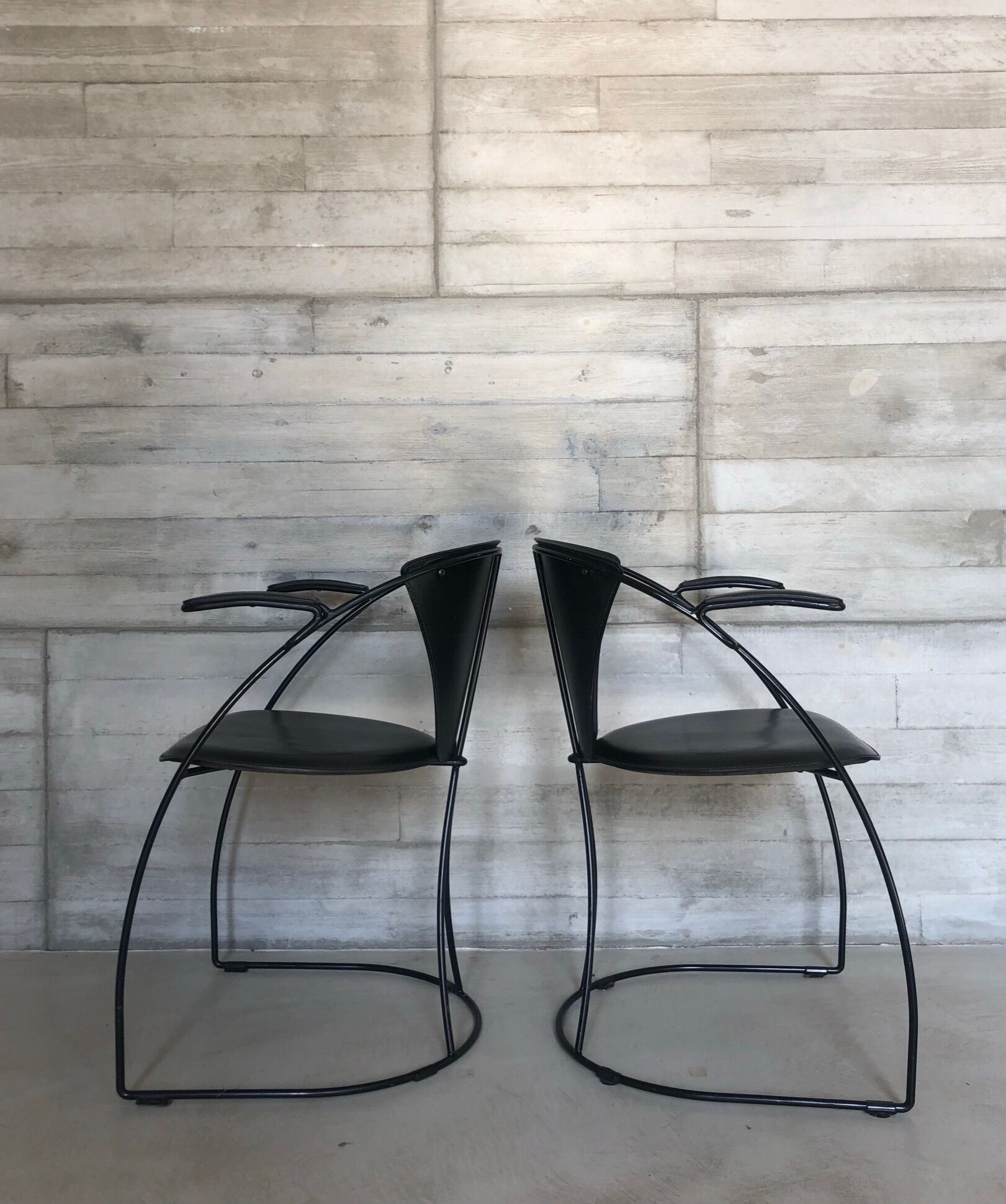 “Armlinda” black leather dining chairs by Arrben Italy