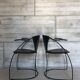 “Armlinda” black leather dining chairs by Arrben Italy