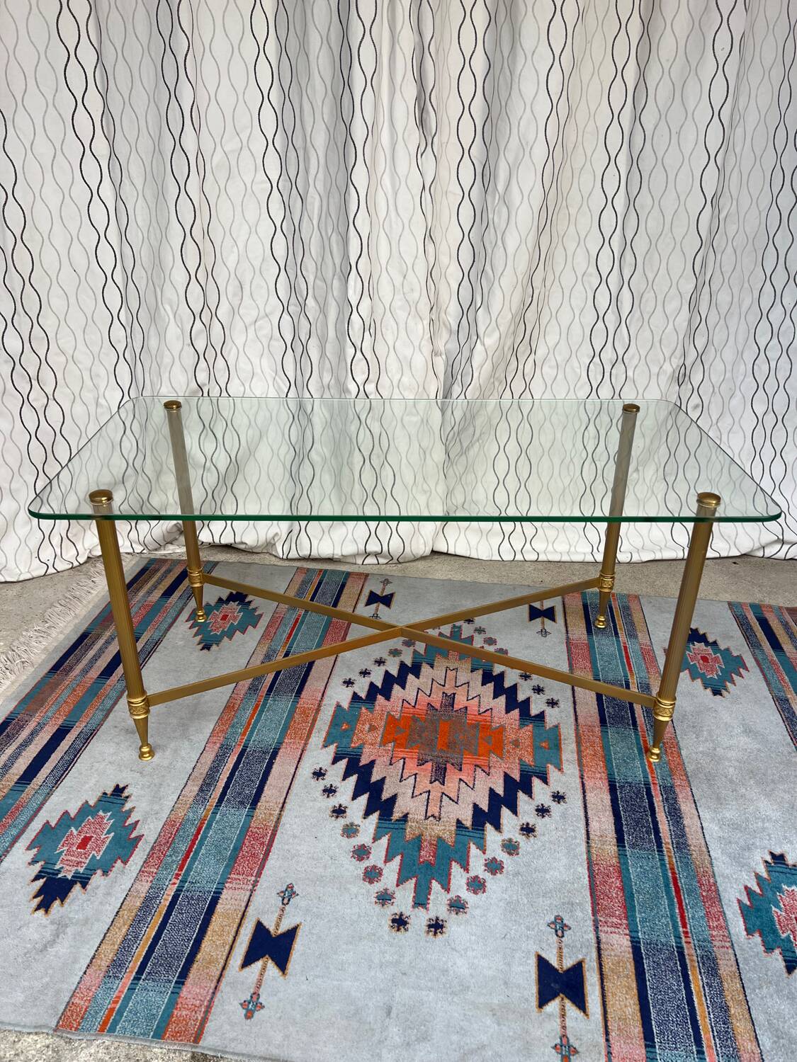 Vintage gold coffee table. Glass top.