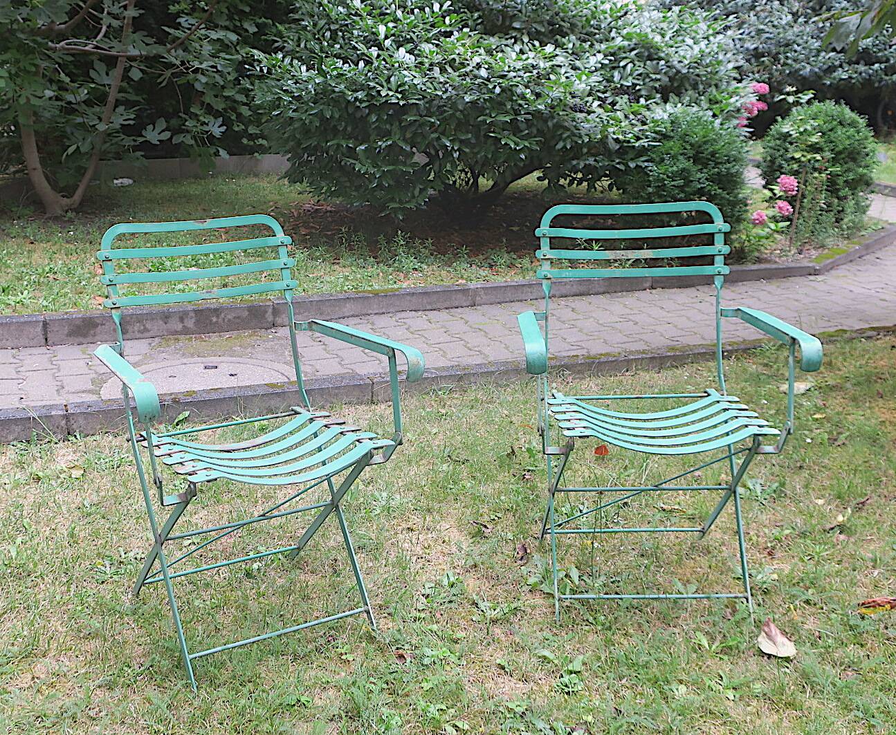 Pair of mid century distressed painted iron garden chairs