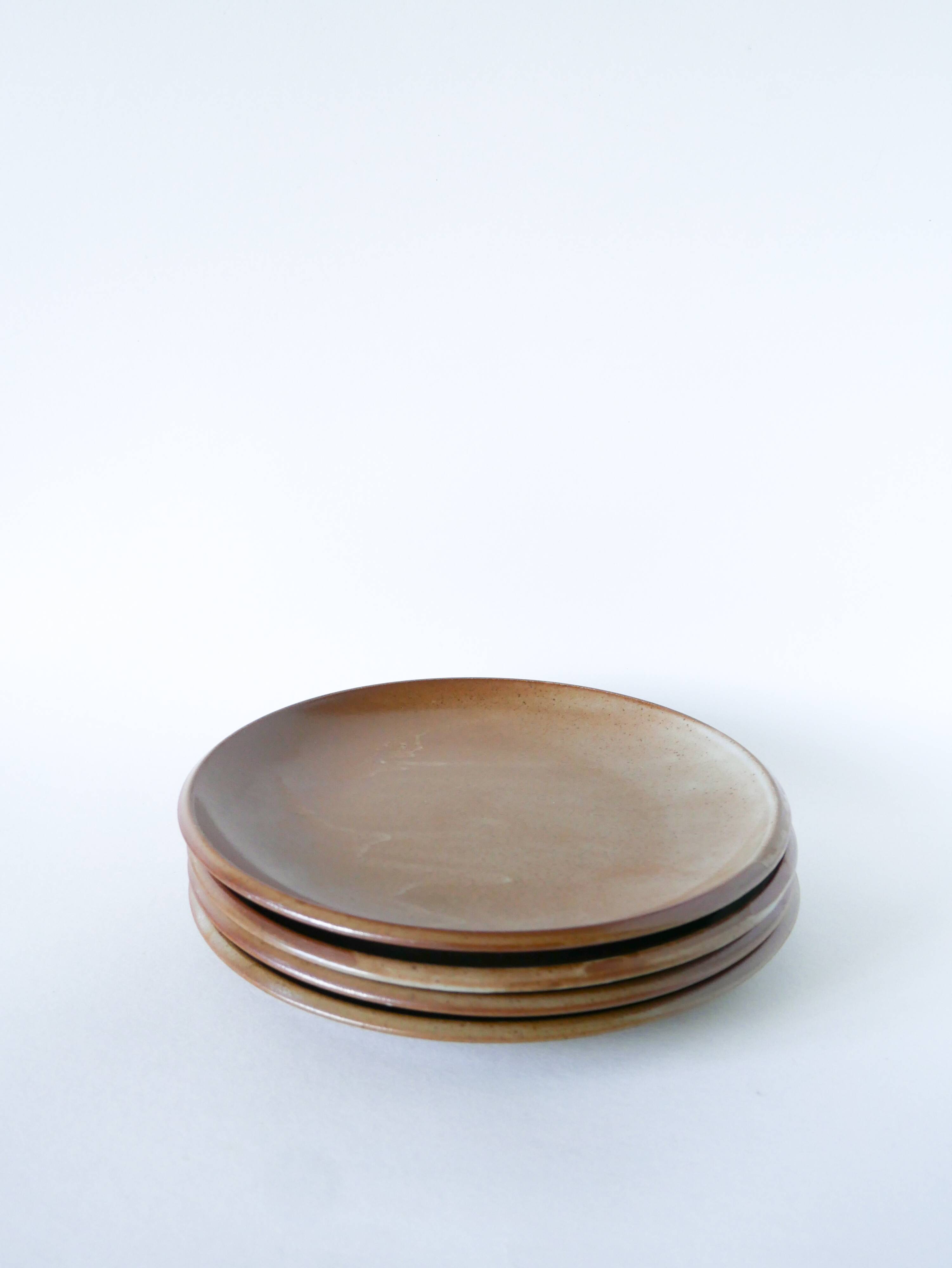Set of 4 large flat plates in stoneware, Brenne stoneware, 1970.
