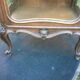 Louis XV Rocaille style showcase in solid walnut, beveled door glass.