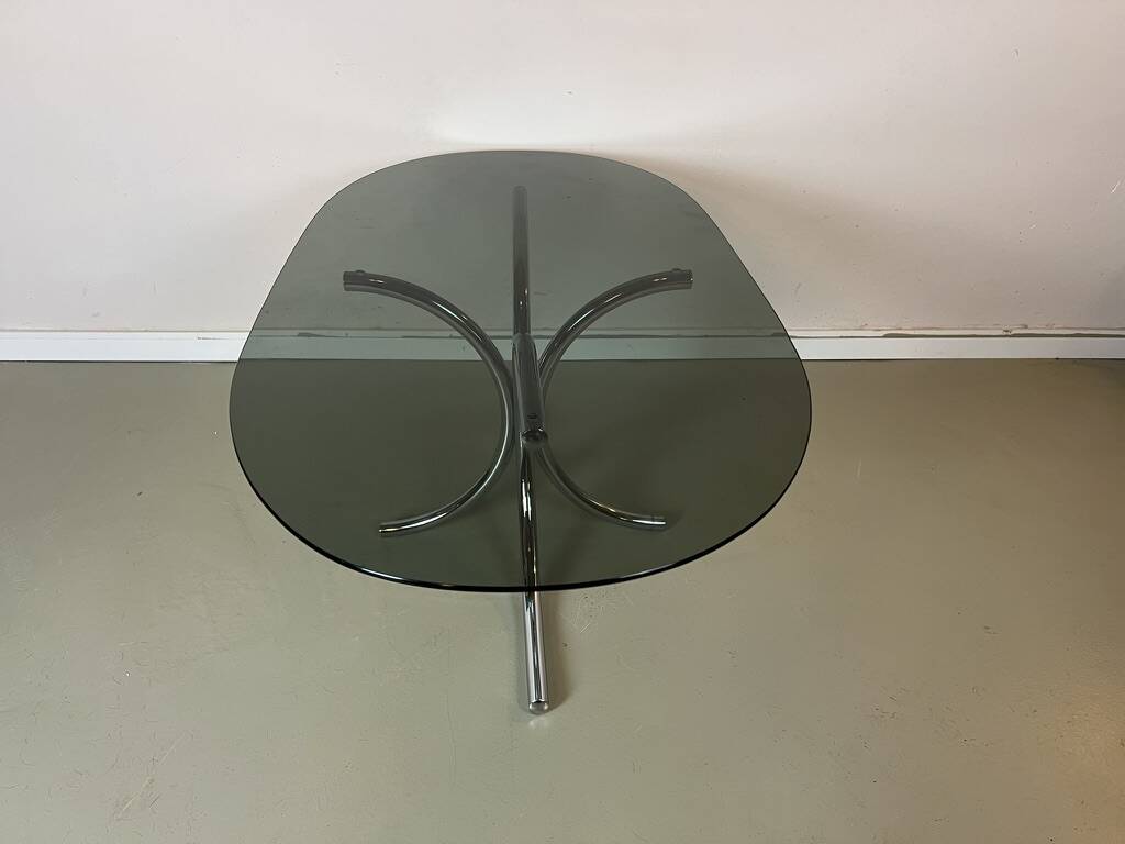 Vintage coffee table from the 70s in smoked glass and chrome, oval, Space Age style.