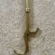 Brass fireplace tools in the style of Maison Baguès.