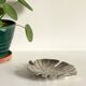 Leaf-shaped metal pocket emptier