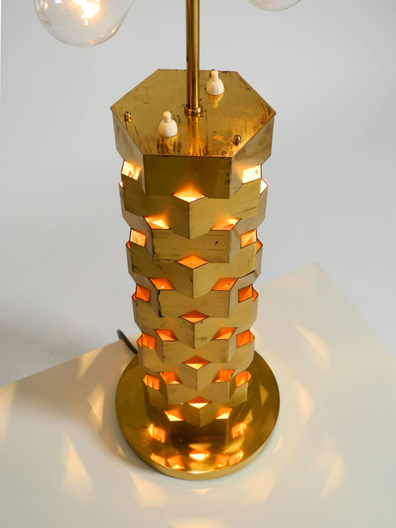 1960s brass table lamp by Vereinigte Werkstätten with an illuminated base