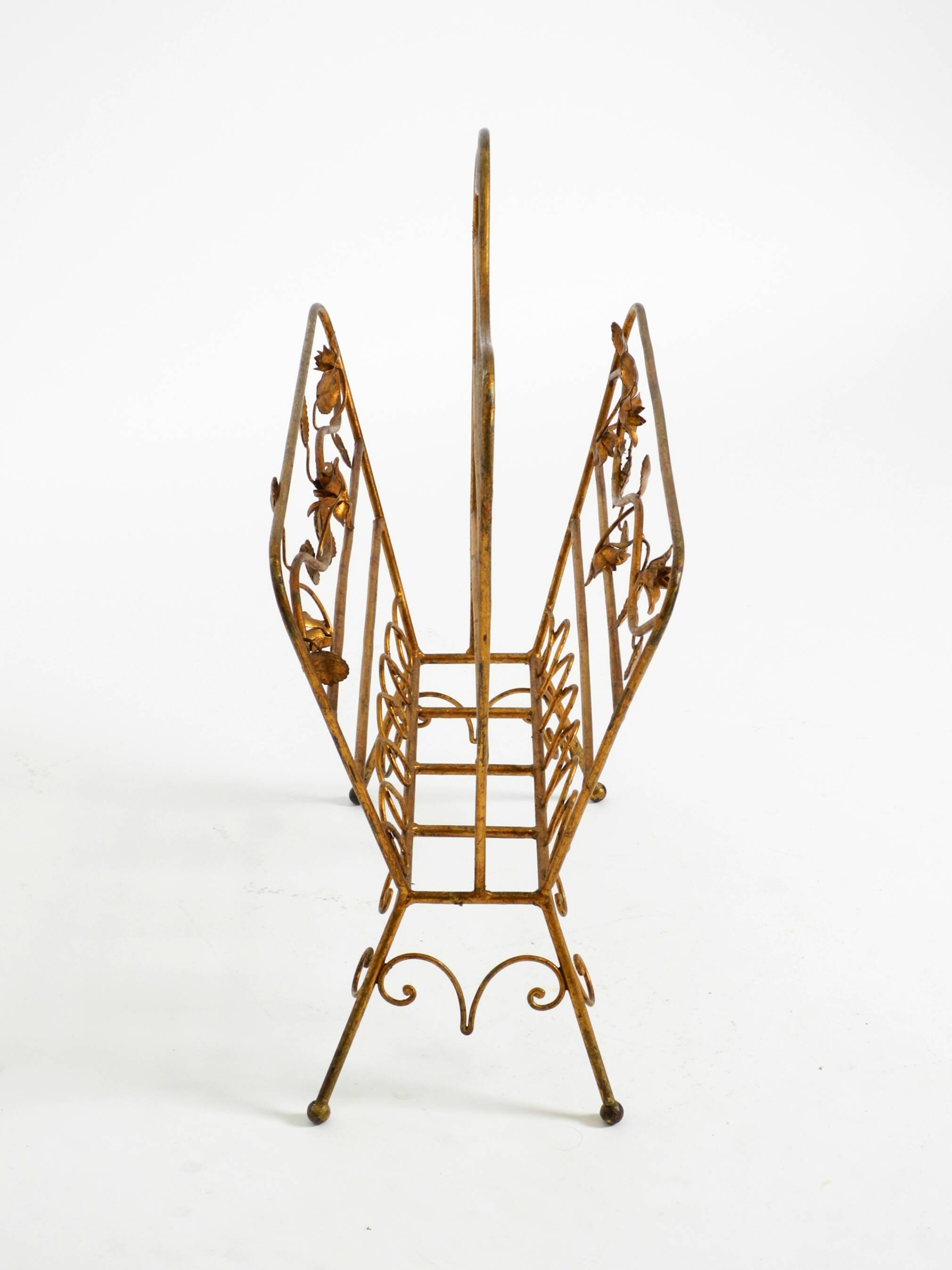 Extraordinary mid-century newspaper and magazine rack with a gilded metal