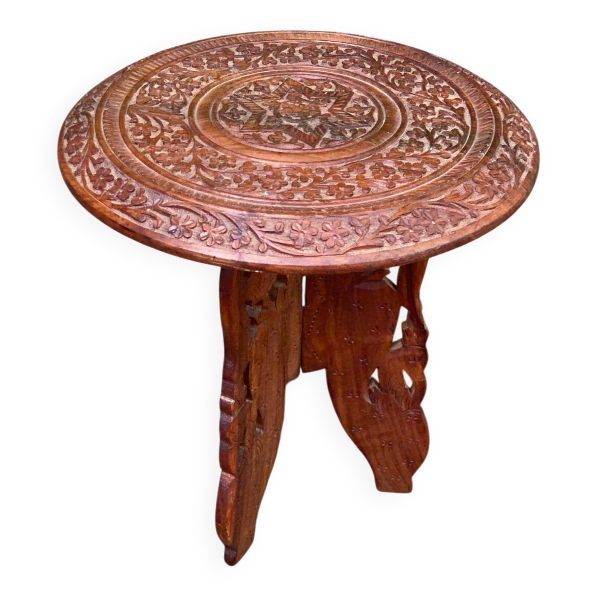Round folding side table made of carved solid wood.