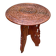 Round folding side table made of carved solid wood.