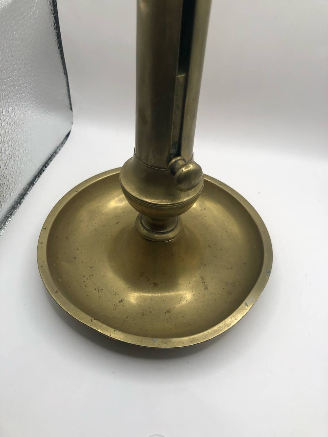 Candle holder with a pusher